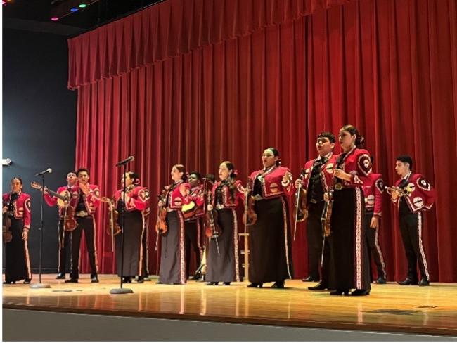 Mariachi playing on stage.